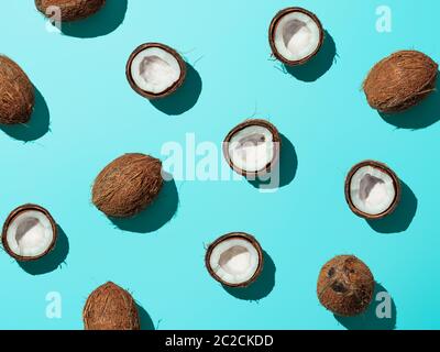 Coconuts half on blue background Stock Photo