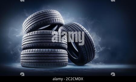 close up of four tires against black Stock Photo