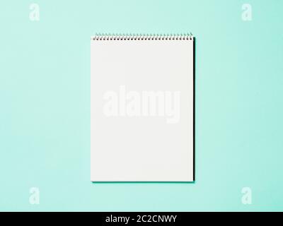Blank paper notebook on blue background Stock Photo