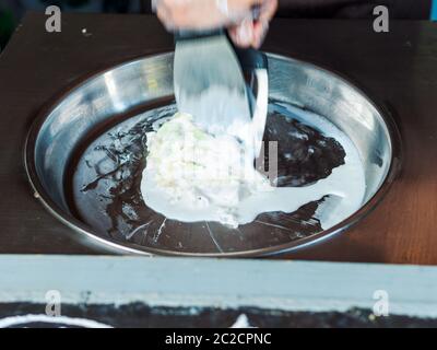 Making rolled ice cream Stock Photo
