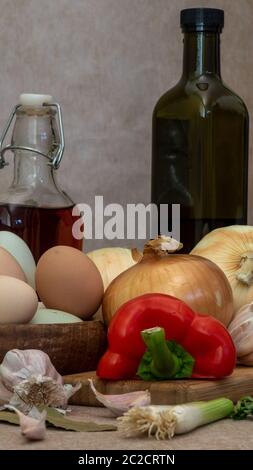 Still life colose-up  portraying ingredients for cooking on green cloth and brown tablecloth, side view and copy-space Stock Photo