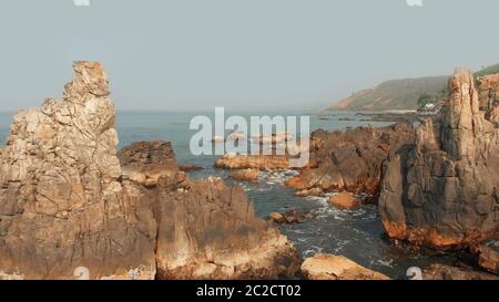 Aerial view rocks and stones on the Arambol beach in North Goa, India. Stock Photo