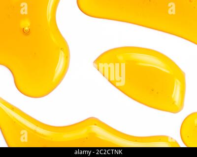 Honey drops abstract pattern, isolated on white Stock Photo