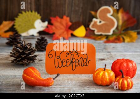Orange Label With English Text Happy Weekend. Autumn Decoration Like Pumpkin, Hedgehog And Squirrel Stock Photo