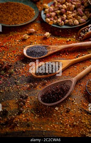 Spices and seasonings for cooking in the composition on the table Stock Photo