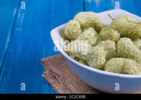 White mulberry on rustic board Stock Photo