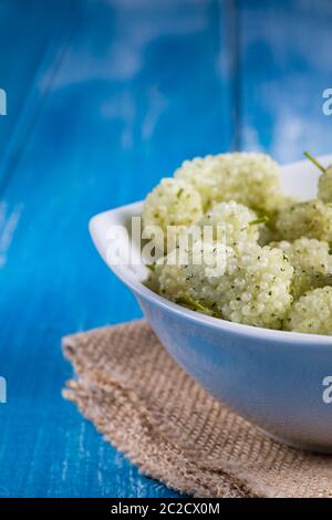 White mulberry on rustic board Stock Photo