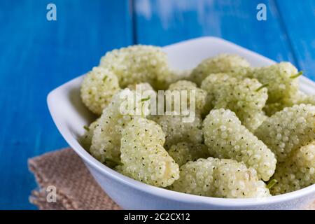 White mulberry on rustic board Stock Photo