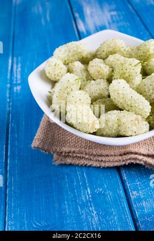 White mulberry on rustic board Stock Photo