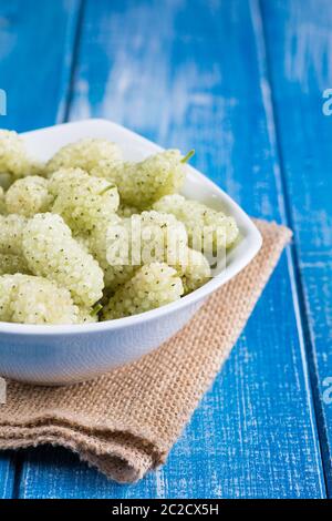 White mulberry on rustic board Stock Photo