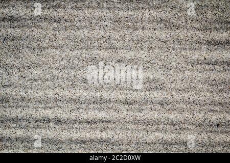 Sandy beach background. Detailed sand texture, top view, stripes Stock Photo