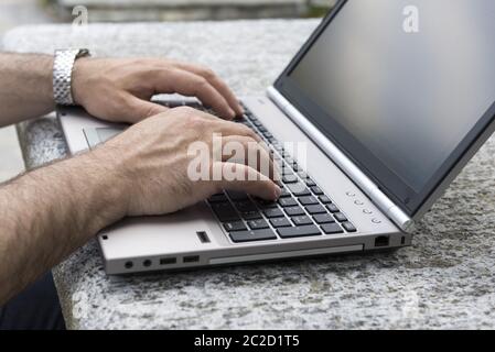 Man Typing on Computer. Stock Photo