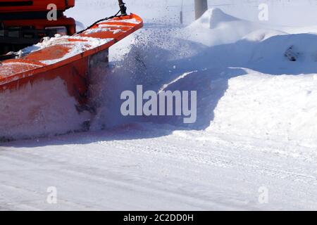 A large truck clears snow from the road. Stock Photo