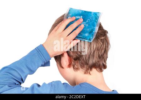 Child cools the forehead with a cold pack Stock Photo