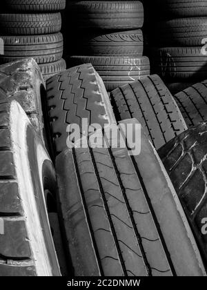 Stacks of old used tires. It can be used as concepts and background. Stock Photo
