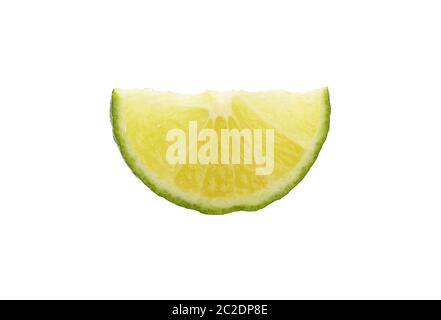 Close up one round thin cut slice of fresh green lime fruit, backlit and isolated on white background Stock Photo