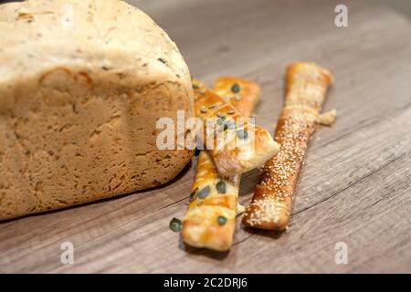 Molded home made bread and roll on table Stock Photo