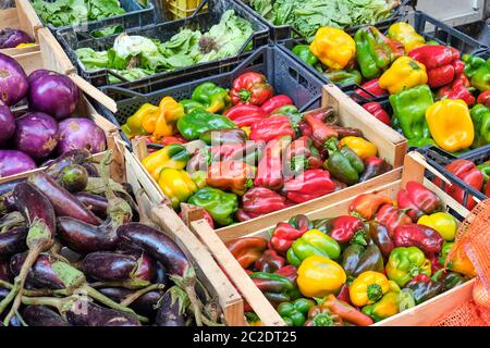 Colorful bell peppers and other vegetables for sale at a market in Naples, Italy Stock Photo