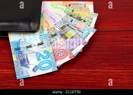 Full set of Kuwaiti Dinar in the black wallet Stock Photo
