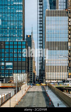 Street view of Hudson Yards with Empire State Building in background in midtown New York City Stock Photo