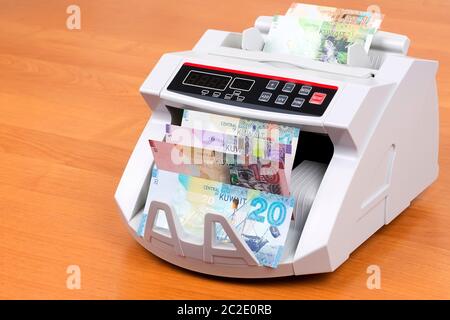 Kuwaiti money in a counting machine Stock Photo