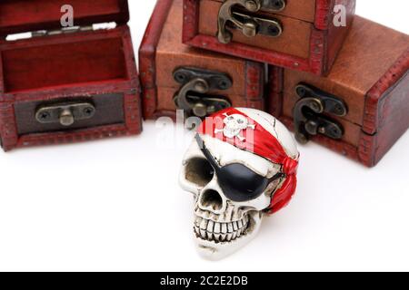 Skeleton pirate with treasure chest on white background Stock Photo