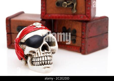 Skeleton pirate with treasure chest on white background Stock Photo
