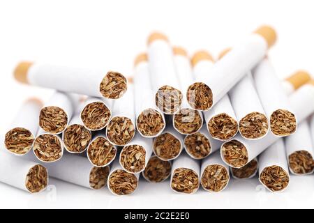 Heap of cigarettes on white background Stock Photo