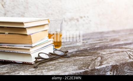 books and reading glasses Stock Photo