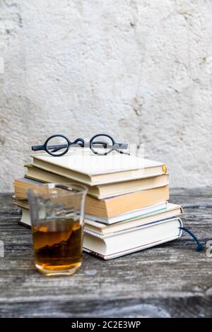 books and reading glasses Stock Photo