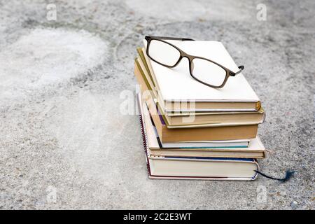 books and reading glasses Stock Photo