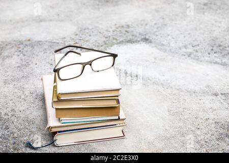 books and reading glasses Stock Photo