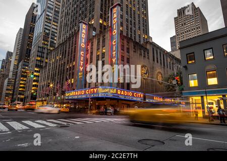 Rush hour traffic at Radio City Rockfeller Center in midtown Manhattan Stock Photo