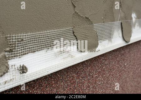 Insulation from expanded polystyrene, plaster and mesh Stock Photo