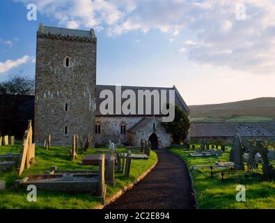 View SSW of the Medieval Church of St Cenydd at Llangennith, Gower, Wales, UK, where St Kenyd established his monastery in the C6th. Stock Photo