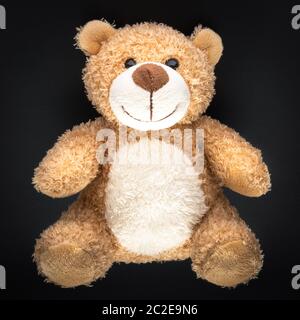 teddy bear isolated on black background Stock Photo