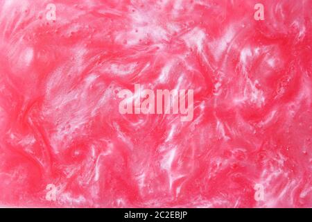 Shiny pink abstract texture of shimmer edible glitter. Stock Photo