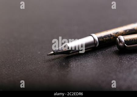 automatic plastic ballpoint pen with clipping path on black background. close up. Stock Photo