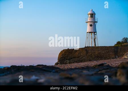 Black Nore Lighthouse in Portishead, Somerset, UK, at sunset on a summer evening. Stock Photo