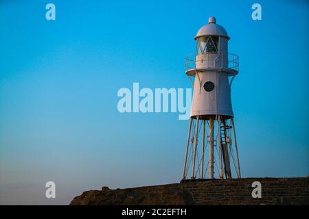 Black Nore Lighthouse in Portishead, Somerset, UK, at sunset on a summer evening. Stock Photo