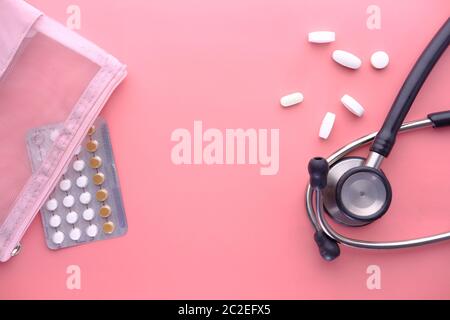 birth control pills on pink background, Top view  Stock Photo