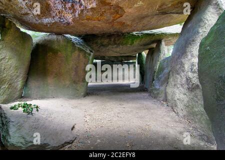 Inside a prehistoric burial chamber or Dolmen La Roche aux Fees - most important megalithic monument of Brittany Stock Photo