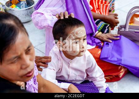 A Visiting Family At The Shwedagon Pagoda, Yangon, Myanmar. Stock Photo