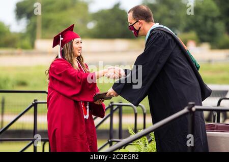 The Sherman High School Class of 2020 commencement ceremony is held on June 13 at Bearcat Stadium in Sherman, TX. Stock Photo