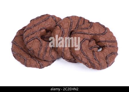 Heap of chocolate round cookies with heart-shaped hole isolated over white background Stock Photo