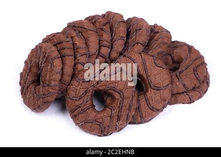 Heap of chocolate round cookies with heart-shaped hole isolated over white background Stock Photo