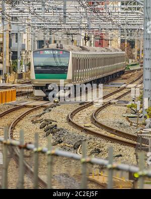 Train Arriving to Station, Tokyo, Japan Stock Photo