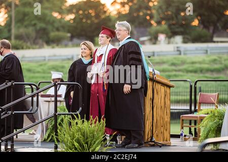 The Sherman High School Class of 2020 commencement ceremony is held on June 13 at Bearcat Stadium in Sherman, TX. Stock Photo