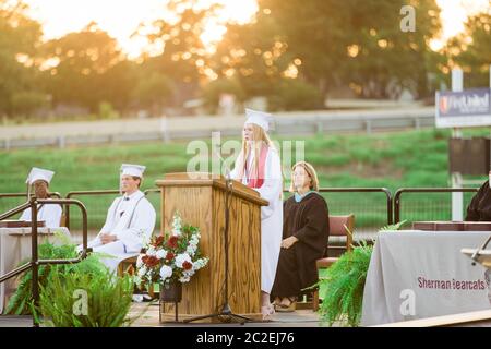 The Sherman High School Class of 2020 commencement ceremony is held on June 13 at Bearcat Stadium in Sherman, TX. Stock Photo
