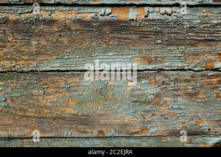 surface of an old wooden wall with peeling paint Stock Photo